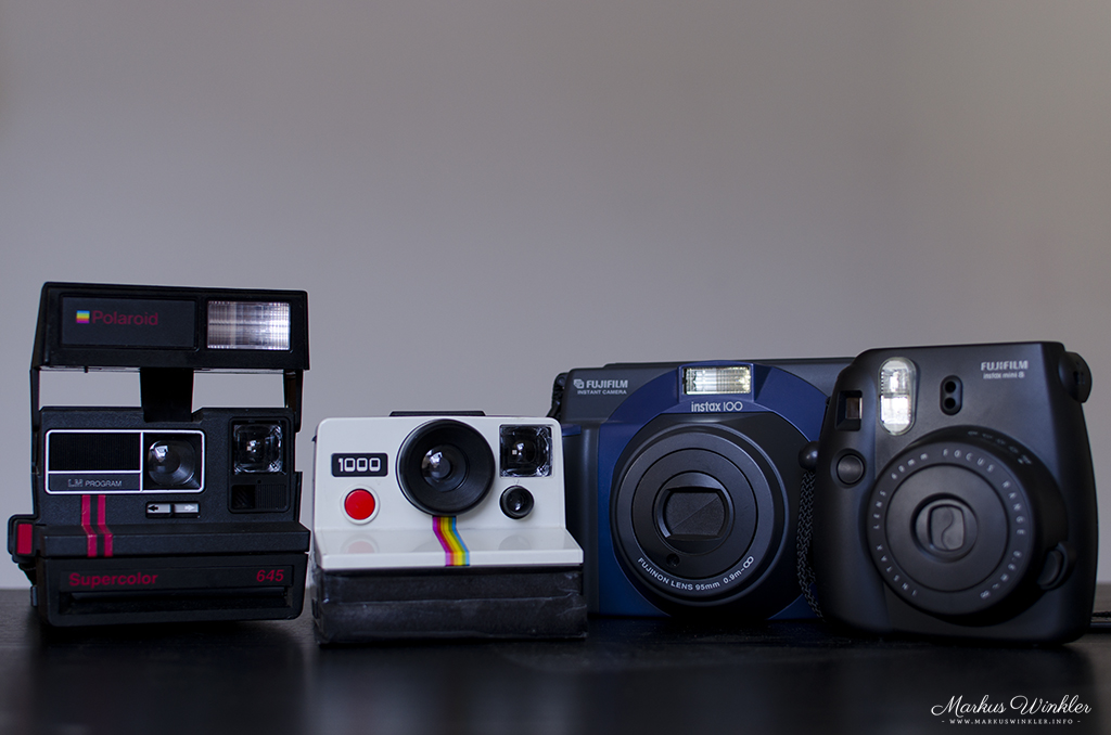 vier verschiedene Sofortbildkameras- und formate
